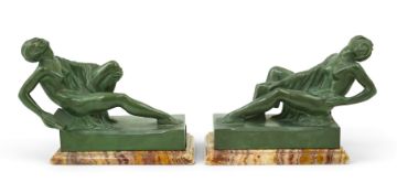 A pair of French Art Deco spelter bookends with simulated verdigris patination, each modelled as a