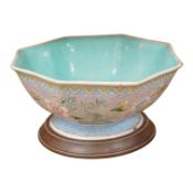 A Chinese pink ground famille rose octagonal bowl, Qianlong mark but 19th century, painted with