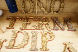 Twelve carved giltwood alphabetic letters, each approximately 23cm high
