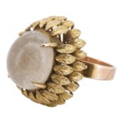 A rutilated quartz cocktail ring, mid 20th century, set with a cabochon of rutilated quartz,