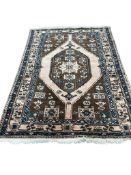 A Persian peach ground rug, 200 x 144cm
