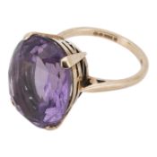 An early 1970's 9ct gold and single stone oval cut amethyst set ring, size N, the amethyst