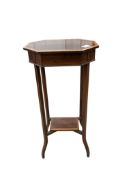 An Edwardian octagonal satinwood banded mahogany two tier occasional table, width 36cm, depth