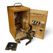 An early 20th century E. Leitz, Wetzlar, monocular microscope, in a cedar case, together with a