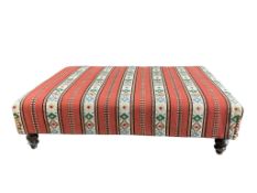 A large rectangular coffee table / stool with polychrome Kilim upholstery on turned feet, width