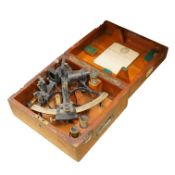 An early 20th century brass and lacquered sextant without maker’s mark, the mahogany case containing