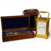An early 20th century brass repeating carriage clock, 16cm high including handle, in JW Benson/