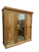 A late Victorian Aesthetic Movement ash mirrored compactum wardrobe by Lamb of Manchester, width