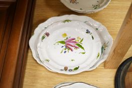 Three 18th century French or German faience dishes and four similar plates, largest 30cm wide