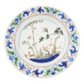 A Chinese famille verte dish, Kangxi period, painted with deer and foliage, 39cm in diameter