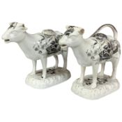 A pair of early 18th century Cambrian pottery cow creamers, 18cm wide