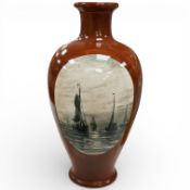 A large Gouda art pottery vase painted with Dutch sailing vessels after HW Mesdag, 57cm high