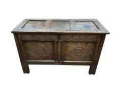 An 18th century panelled and carved oak coffer, width 109cm, depth 50cm, height 69cm