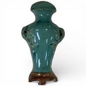 A Chinese Guandong turquoise glazed pottery wall vase, early 20th century, 25cm high
