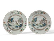 A pair of Chinese famille rose landscape plates, Qianlong period, 23cm in diameter