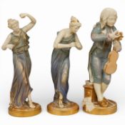 A pair of Royal Worcester blush ivory female dancers, date-code 1926, and similar youth tuning his