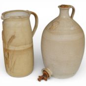 A buff-coloured stoneware flagon and similar jug, relief-moulded with wheat, unsigned, flagon 33cm.