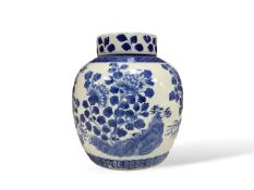 A Chinese porcelain jar and cover painted in underglaze blue, Kangxi mark but 19th century, 21cm