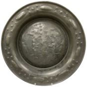 A North European pewter alms dish, decorated in relief with Adam and Eve, 40cm in diameter