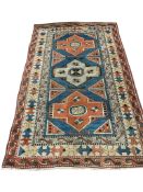 A Turkish Caucasian style blue ground rug, 210 x 130cm