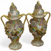 A pair of English porcelain floral encrusted vases and covers, c.1830, possibly Samuel Alcock,