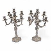 A pair of silver plated Rococo style six branch, seven light candelabra, 49cm