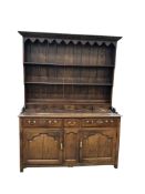 An 18th century oak dresser with boarded rack, width 160cm, depth 60cm, height 215cm