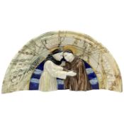 A glazed pottery semi circular door plaque, in the Della Robbia style, unsigned, 34cm high