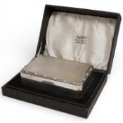 A cased Elizabeth II part engine turned silver mounted rectangular cigarette box, by Adie