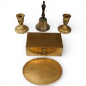 A Chinese engraved brass box, pair of similar candlesticks and an oval tray, and a bronze hand-bell,