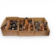 A collection of twenty woodworking planes, including an unmarked gunmetal chariot plane, together