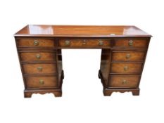 A reproduction mahogany pedestal dressing table, width 140cm, depth 47cm, height 78cm