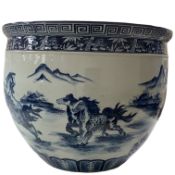 A large Chinese blue and white jardiniere decorated with horses in a landscape, 54cm in diameter