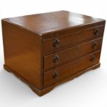 A walnut canteen of Garrard & Co. silver plated cutlery, three fitted drawers, 34 x 53cm.