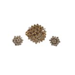 A modern 9ct gold and brown diamond cluster ring, size L/M and a pair of similar ear studs, gross