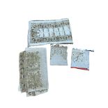 An Ottoman gold thread embroidered towel together with a smaller similar Turkish towel and towel end