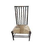 Attributed to William Morris for Liberty & Co., An Arts & Crafts rush seated chair, width 49cm,