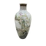A Chinese famille rose bottle vase decorated with birds and flowers, 20cm high