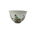 A Chinese famille rose porcelain tea cup enamelled with three figures, 6cm in diameter