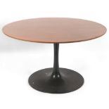 A mid century Arkana circular teak tulip dining table on black painted base, diameter 136cm,