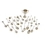 Golfing Interest, a silver trophy, twenty-one spoons and a medal, the trophy for the G.D.G.C