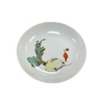 A Chinese porcelain saucer hand painted with vegetables, 15cm in diameter