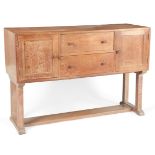 Heal's of Tottenham Court Road: A Cotswold School style limed oak dresser/sideboard
