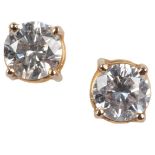 A pair of diamond stud earrings, each set with a brilliant-cut diamond weighing approximately 0.40