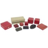 A collection of jewellery cases, comprising: two ring cases and a cufflink case by Cartier, a