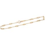 A gold watch chain, France, early 20th century, of belcher linking, interspersed with oval