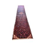 A Malayer blue ground runner, 490 x 84cm