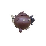 A Chinese Yixing pottery lotus and mushroom teapot, 18cm wide