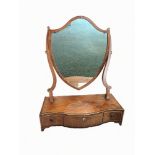 A 19TH CENTURY SHIELD-SHAPED TOILET MIRROR the serpentine front base fitted with three drawers and