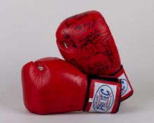 A pair of red leather Pro Tec autographed boxing gloves